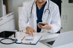 Physician signing medical billing contract
