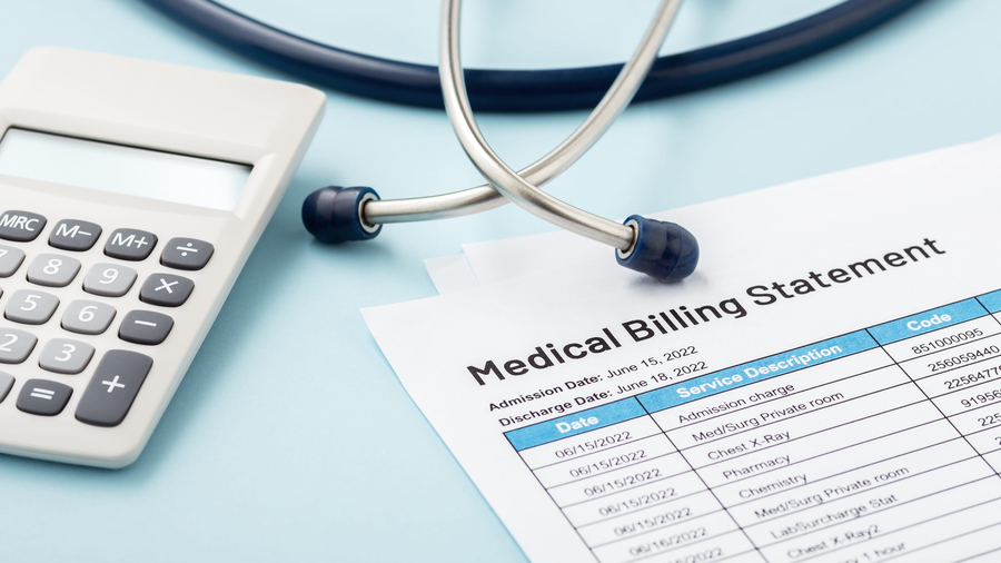 Medical billing statement with stethoscope and calculator